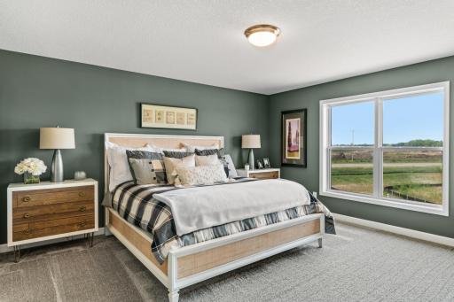 Find your retreat in this stunning owner’s suite. Enjoy the exclusivity of a private bath and huge walk-in closet. (*Photo of decorated model, actual homes colors and finishes will vary)