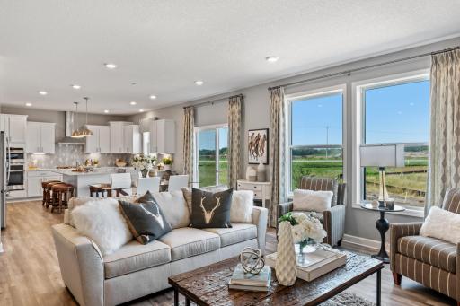 The spacious and open-concept main level allows for optimal versatility and comfort. (*Photo of decorated model, actual homes colors and finishes will vary)
