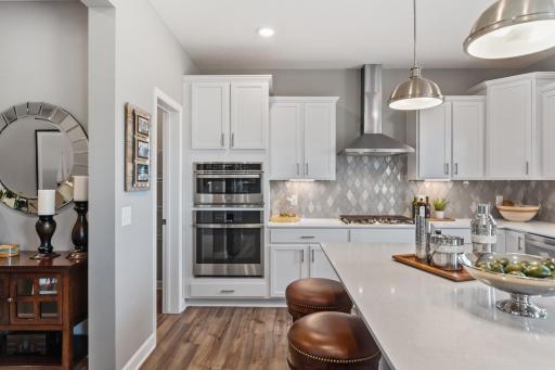 Open and naturally bright, the home's kitchen space is highly desirable (*Photo of decorated model, actual homes colors and finishes will vary)