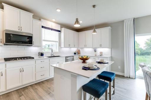 Plenty of space to work in this kitchen... And look at all that storage!!! *photo of model home