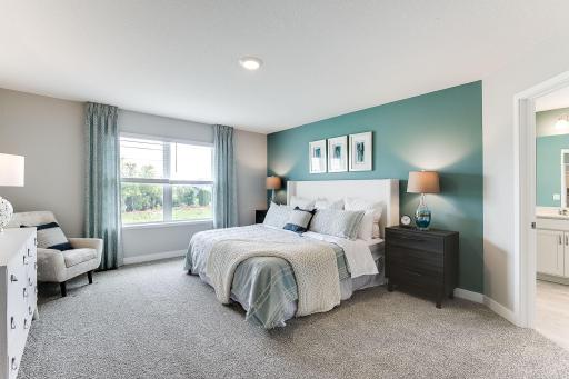 Spacious, spacious, spacious! A king-size bed looks small in this room! The primary suite offers plenty of space for furniture as well as a gorgeous bathroom - with TWO walk-in closets! *photo of model home
