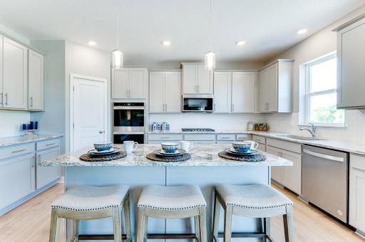 This floor plan includes an amazing kitchen that is ready for hosting any gathering! Model photo. Options and colors will vary.