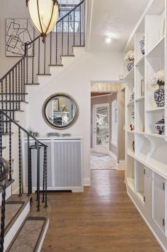 An elegant wrought iron stairway invites you upstairs.