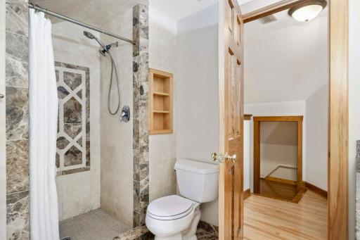 Note the detailed tilework in the shower.