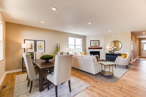 Open-and inviting, the home's living spaces flow seamlessly - a theme consistent throughout the entire layout!! *Photo of previous model. Actual home may vary.