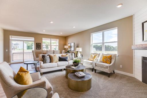 The open feel extends into to the main level family area - which is every bit as inviting and it is beautiful! *Photo of previous model. Actual home may vary.