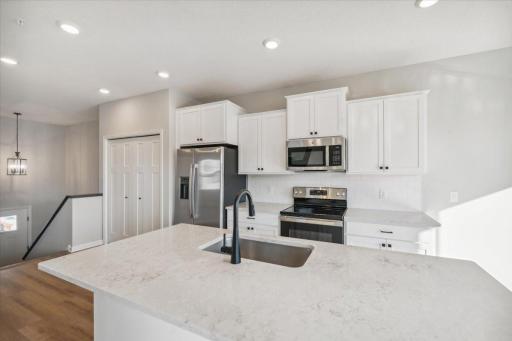Kitchen. Light and Bright!! Quartz countertops and stainless steel appliances.