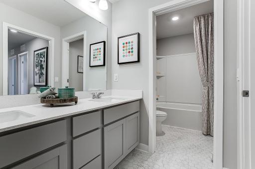 Upper-level hall bath offers a great solution for a busy family with separate tub and shower area.