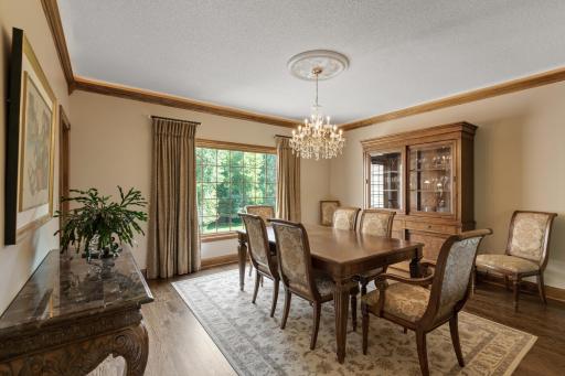 Formal dining space overlooks the back of the home.