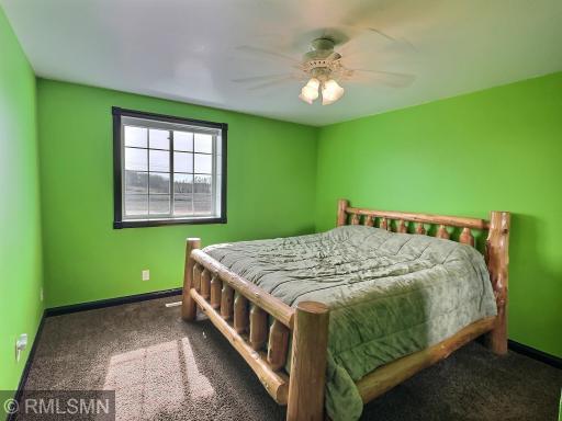The final bedroom completes the upper level offering carpet, ceiling fan, large closet and window with views.
