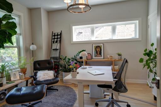 Main level office with glass french doors.