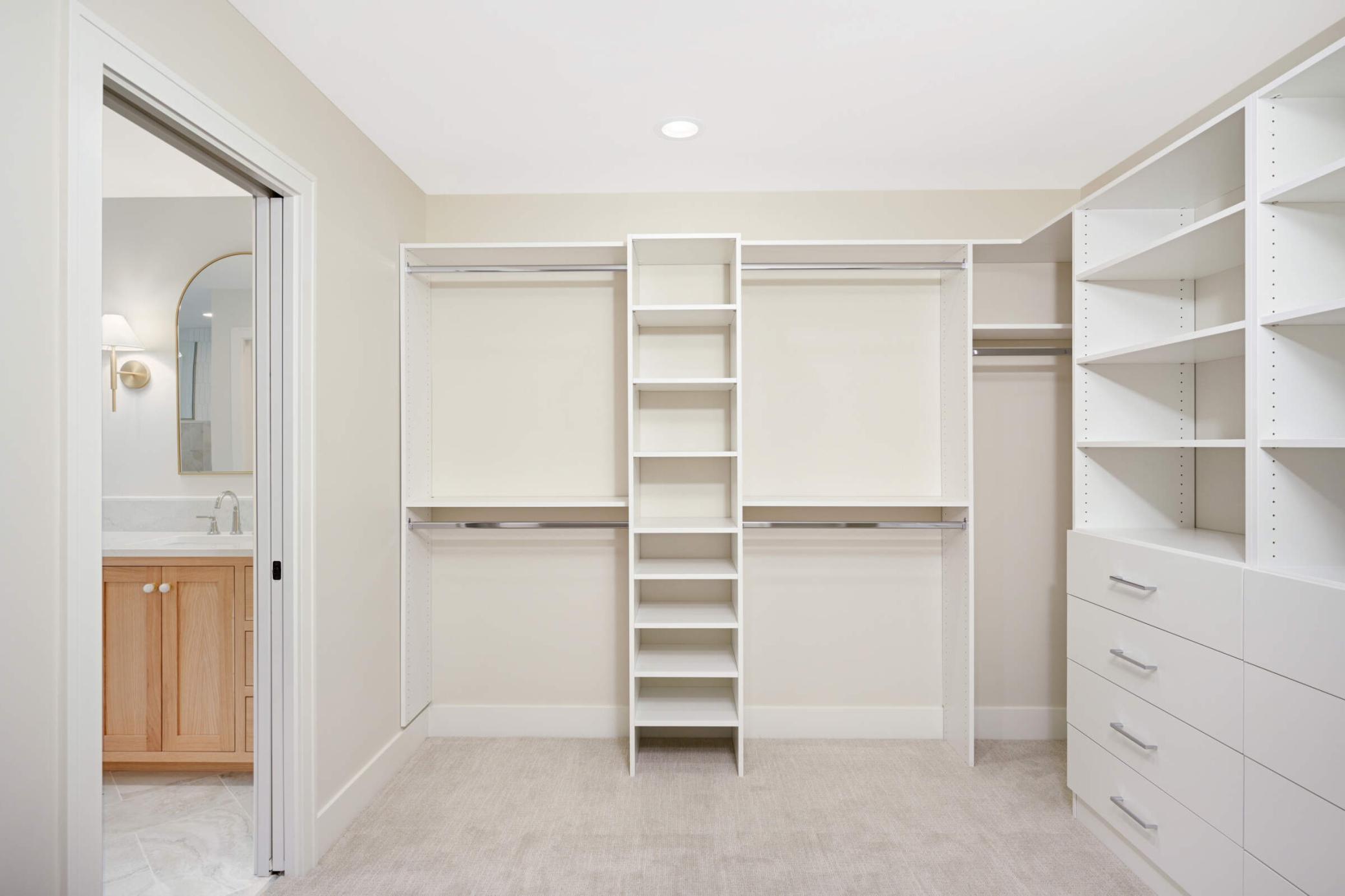 Large wraparound walk-in closet next to the upper level laundry room
