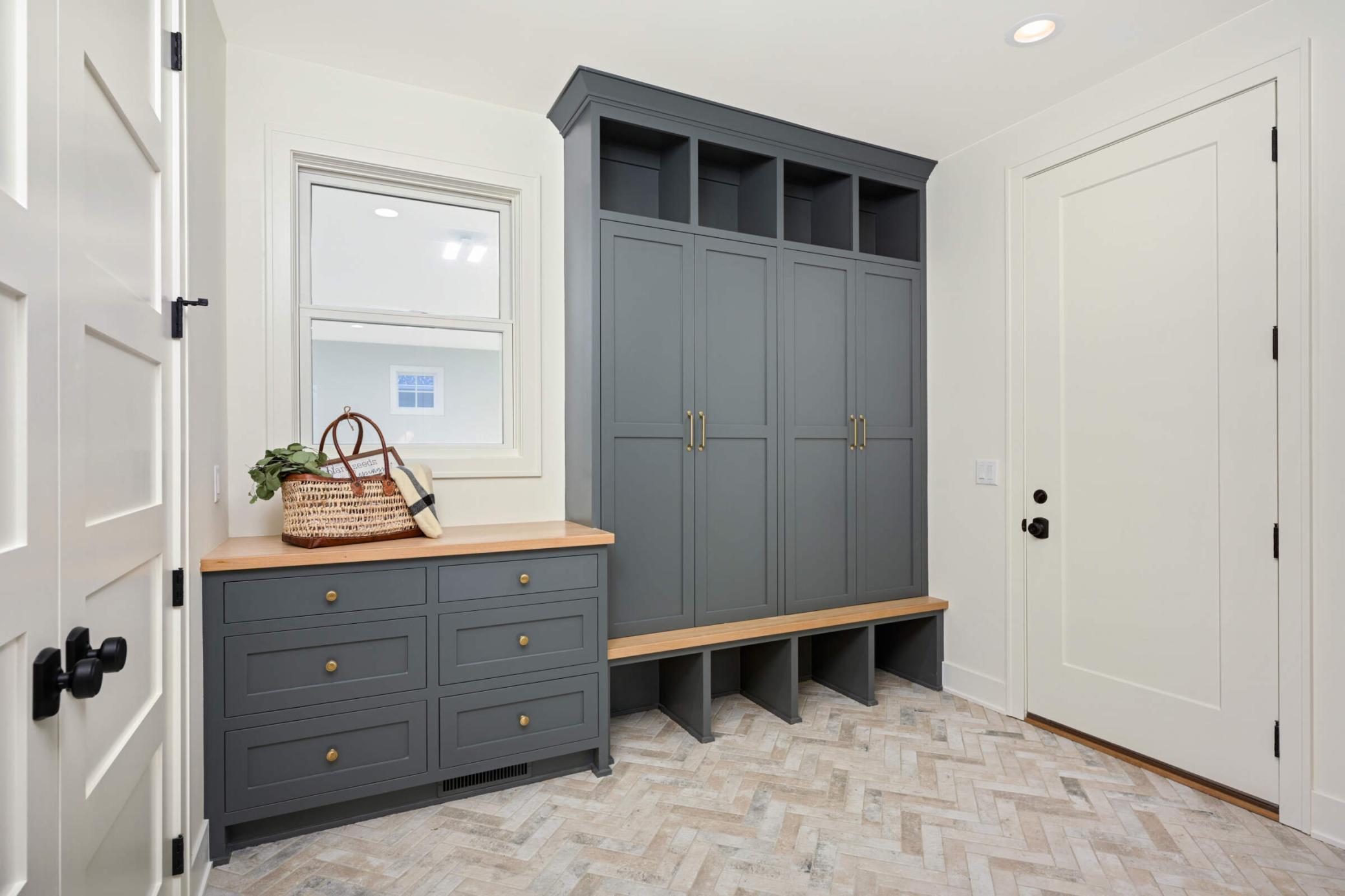 Mud room with window overlooking the sport court