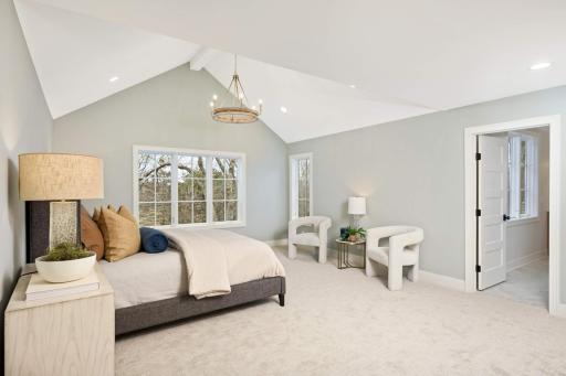 Large primary suite with vaulted ceiling