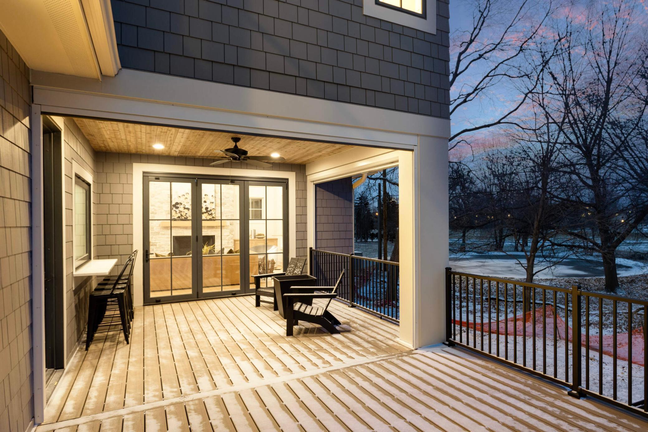 Motorized screened in porch with serving bar and three panel accordion door