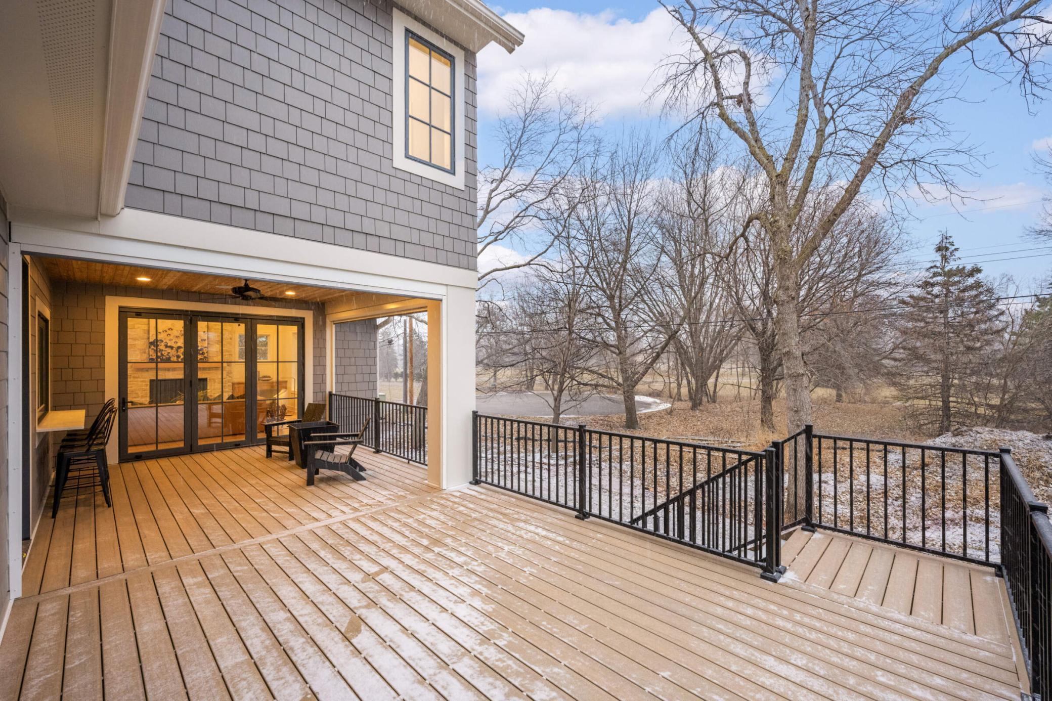 Deck and screened in porch, overlook the large backyard and massive park