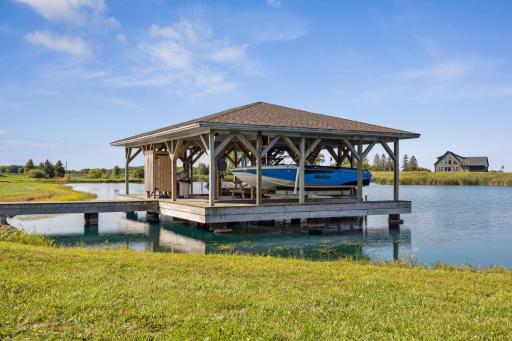 Community dock/boathouse with ski boat that can be rented. No going to a lake and launching your boat, it's all ready to go!