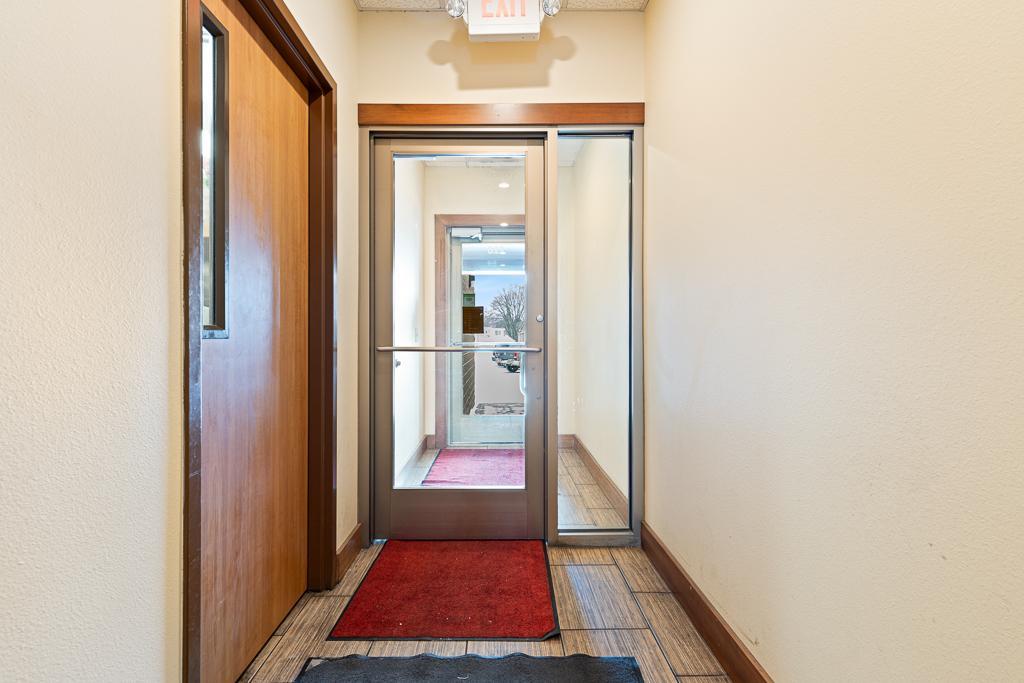 The rear entry with access to a shared parking lot