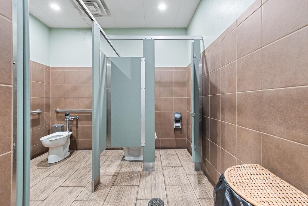 There are 2 stalls in the both the women's and men's restroom, handicap accessible stall