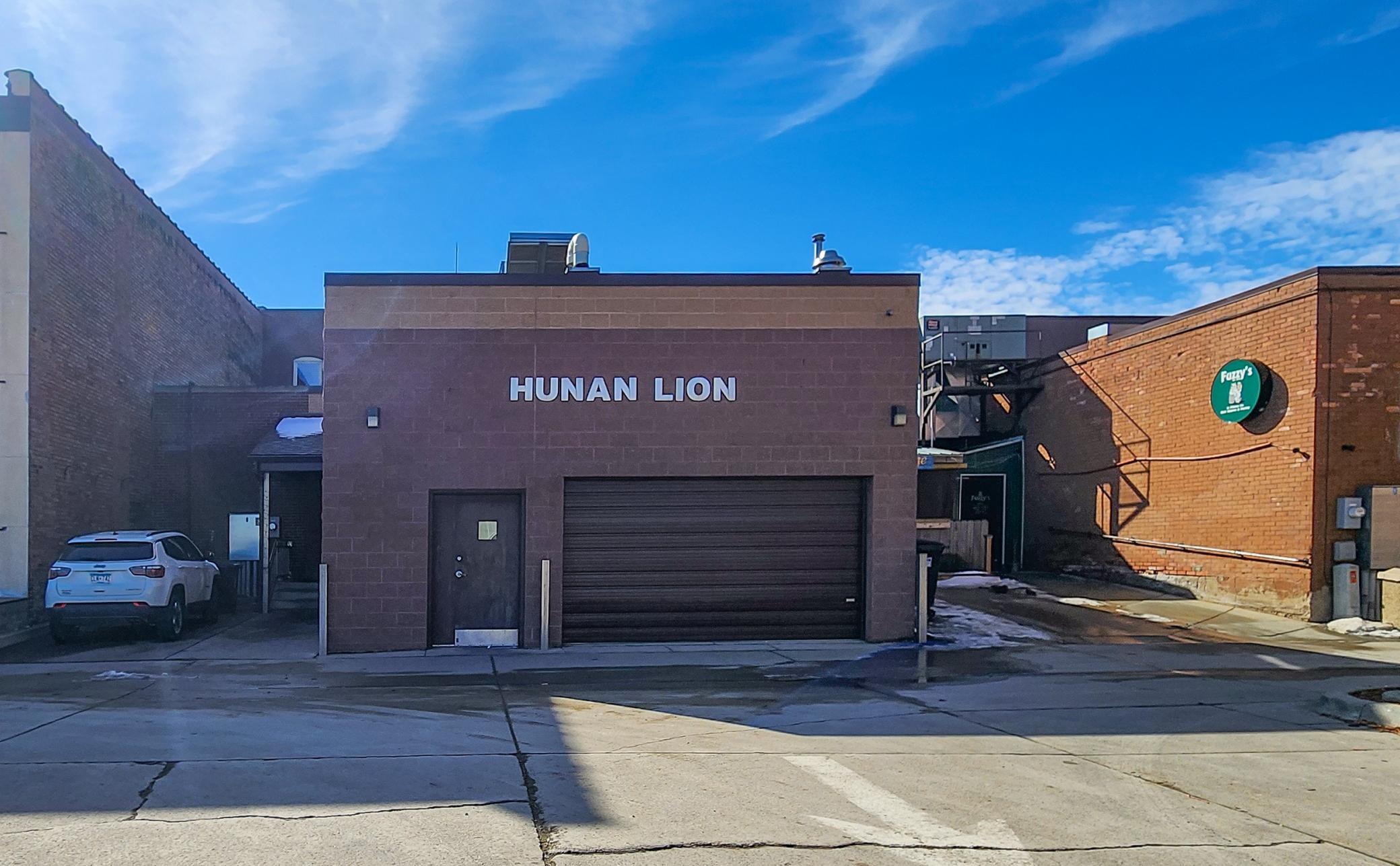 The backside of the building features a patron entry, employee entry, and garage door for those large delivery days!
