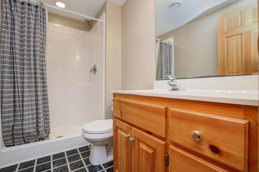 3/4 bathroom in the lower level has new paint and is perfect for family and friends visiting.