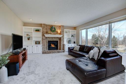 Main level family room boasts new carpet, beautiful windows and gas fireplace. A wonderful place to watch the big game, curl up with a book or catch up with a friend.