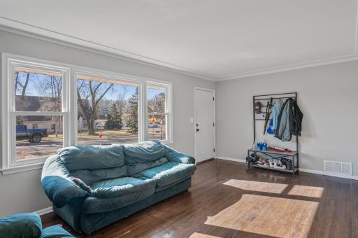 Main level living features a large bay window for plenty of natural light. All windows have been updated in this home!