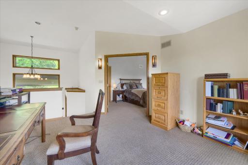 Office Just Off The Primary Bedroom Overlooks The Living Room.