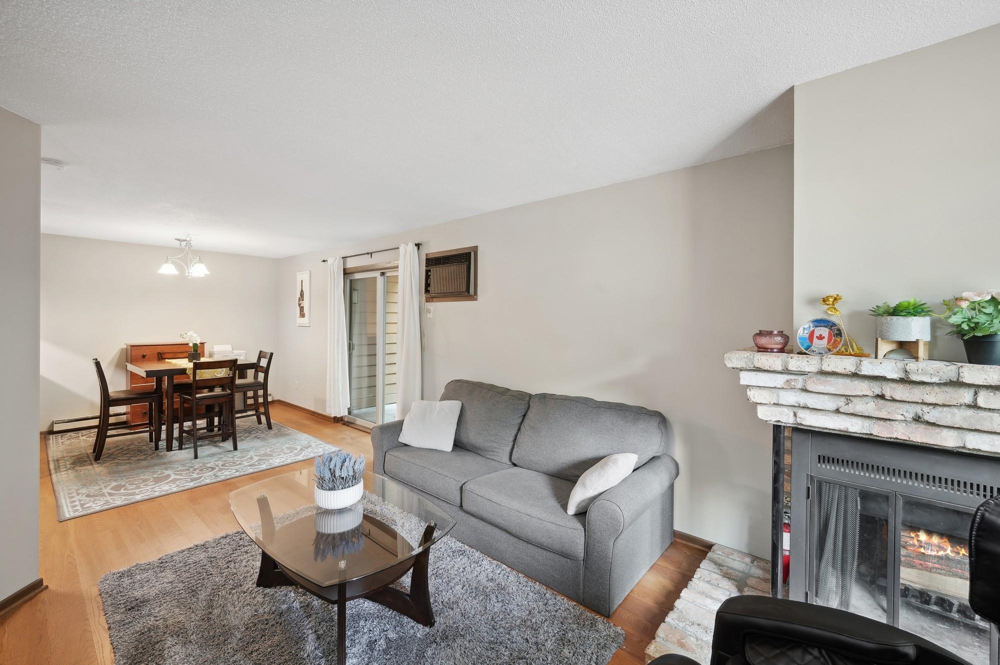 Spacious main floor with newer wood floors and wood burning fire place.