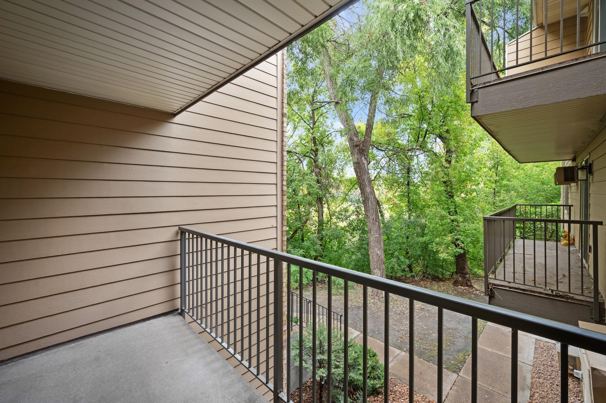 Upper level balcony overlooking the woods/wetland.