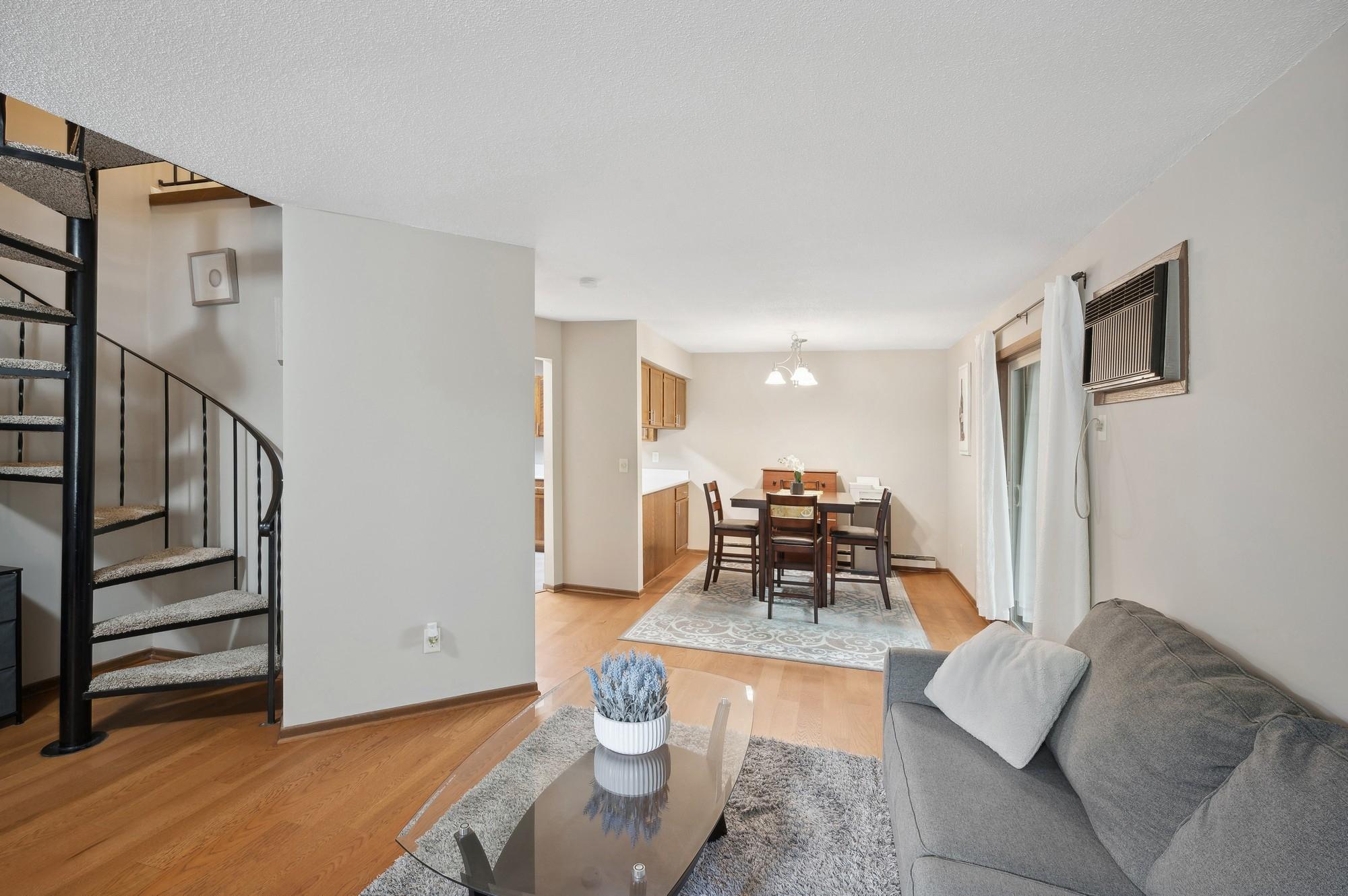 Spiral stairway leading to upper level with full bath and 2 bedrooms.
