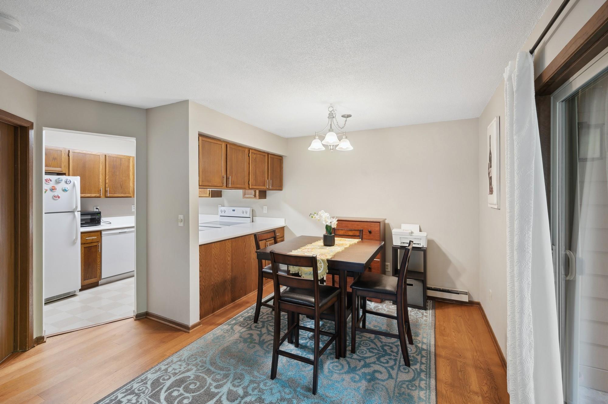 Open concept kitchen and dining area with view of patio.