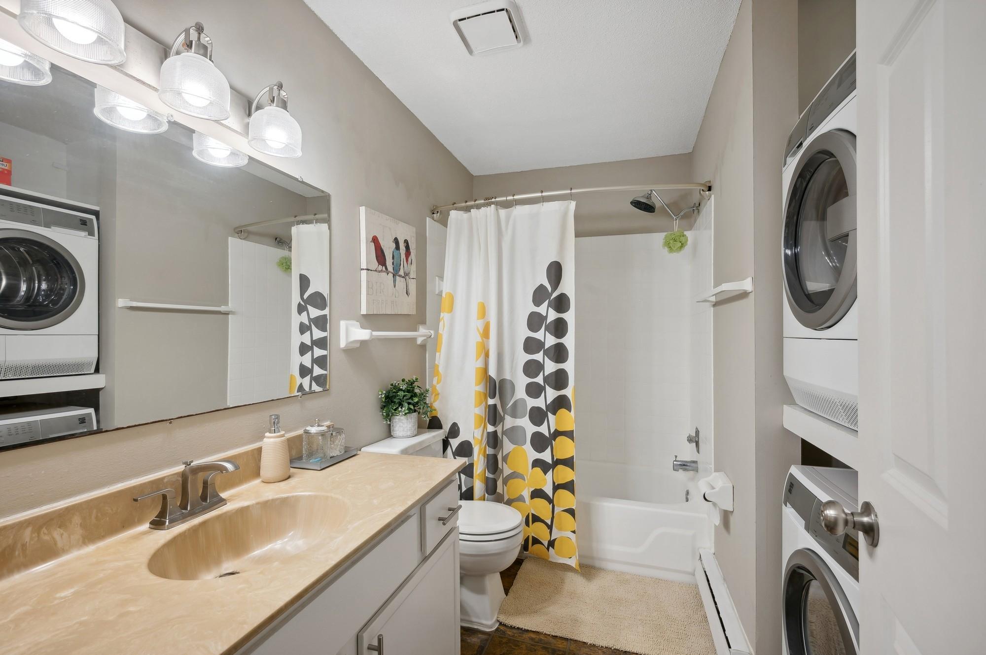 Upper level full bath and in unit laundry with newer washer and dryer.