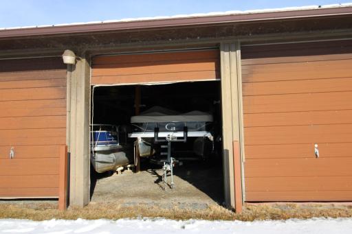 1892 Highway 11 E International Falls, MN 56649 Year round indoor boat storage bay with storage above at private marina. Door on each side of the bay.