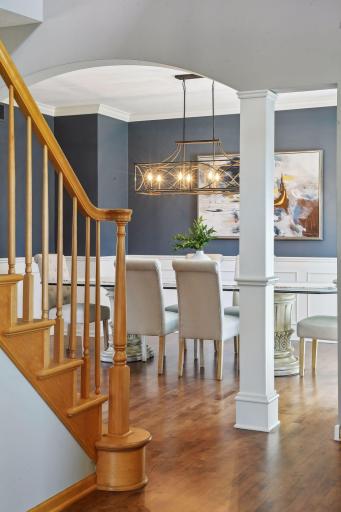 Hardwood floors guide you past the formal dining room.