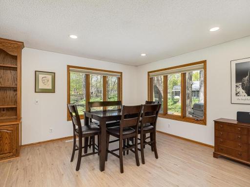 Versatile family room addition with plenty of space for informal dining/board games/designated homework spot/play area filled with natural light from corner windows and views of the backyard.