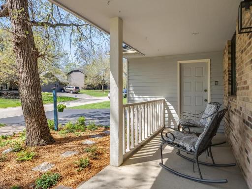 Enjoy the calm and welcoming neighborhood from the front porch, with convenient garage access.