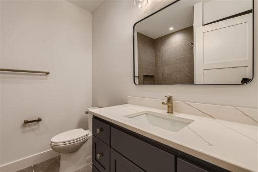Convenient lower level bathroom with tile shower.