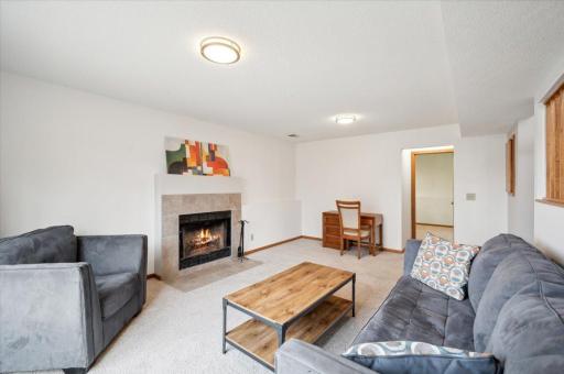 Spacious and large, this living room is the perfect escape with a fireplace and patio doors to the huge backyard.