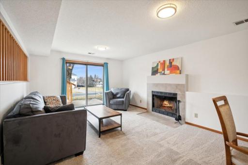 Spacious and large, this living room is the perfect escape with a fireplace and patio doors to the huge backyard.