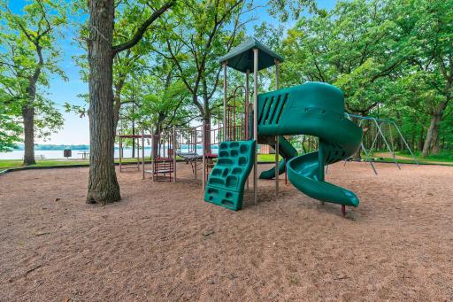 Pleasant Lake Playground with picnic area and private beach.