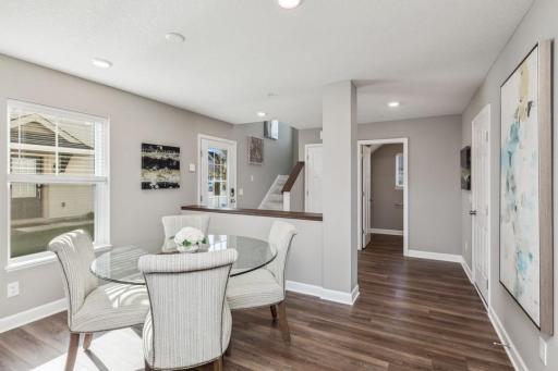 Photo for 21942 Primrose Path, Farmington, MN 55024 - Listing #6486300 Step into a spacious foyer from both the front/side door and the entry, plus a half-bath powder room off the foyer. (Photo of decorated model, actual home's finishes may vary slightly)