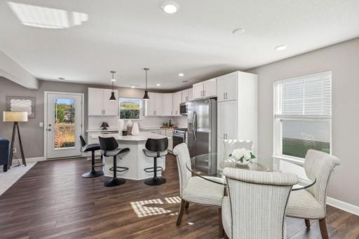 Photo for 21942 Primrose Path, Farmington, MN 55024 - Listing #6486300 Light-filled with three walls of windows - front, side & back (Photo of decorated model, actual home's finishes may vary slightly)