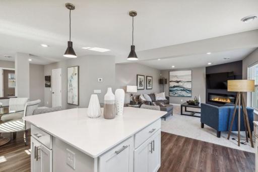 Photo for 21942 Primrose Path, Farmington, MN 55024 - Listing #6486300 Enjoy plenty of seating at the kitchen island and dining area adjacent to the kitchen. Perfect for entertaining or having a family meal together. (Photo of decorated model, actual home's finishes may vary slightly)