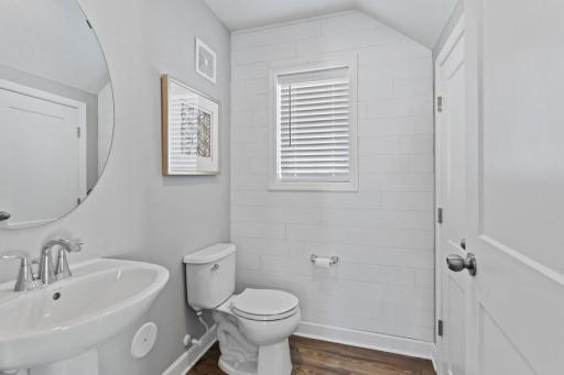 Photo for 21942 Primrose Path, Farmington, MN 55024 - Listing #6486300 Half-bath powder room on the main level off the entry foyer. (Photo of decorated model, actual home's finishes may vary slightly)
