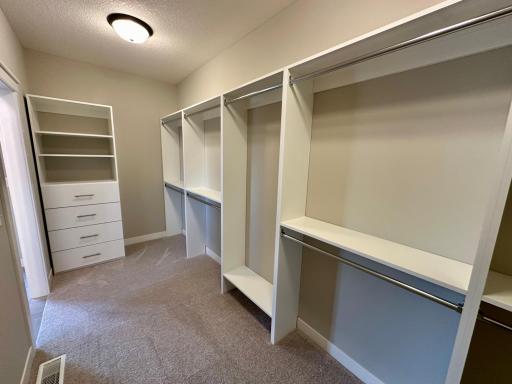 Primary Walk-in Closet w/ Custom Organizers