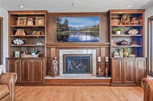 Custom Cherry-built ins surround the gas fireplace!
