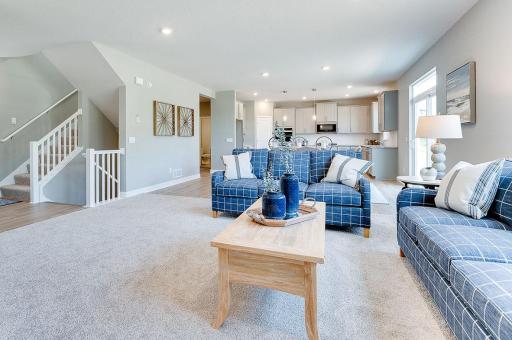 Such a nice open layout with a switch back staircase ready to invite you upstairs to three bedrooms and a loft. *Photos of previous model home. Some colors and selections may vary.