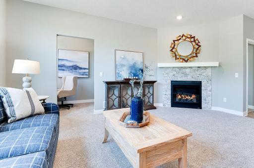 Off to the side of the living room features a pocket office. And of course, a beautiful gas fireplace to make nights extra cozy! *Photos of previous model home. Some colors and selections may vary.
