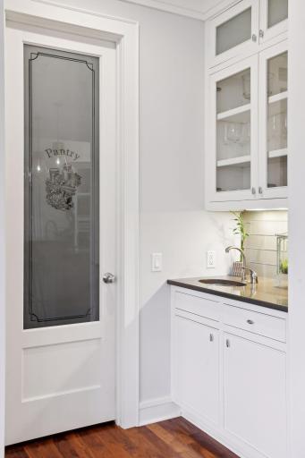 Butler's sink area adjoins the walk-in style pantry.
